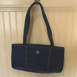 The SaK original teal leather purse.